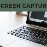 Close-up of an HP laptop keyboard and screen showing a screenshot selection tool.