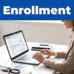 A woman checks enrollment dates on a laptop beside an insurance card and stethoscope.